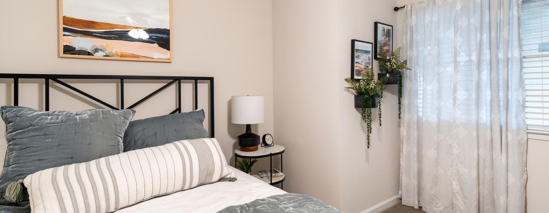 a bed with a white curtain