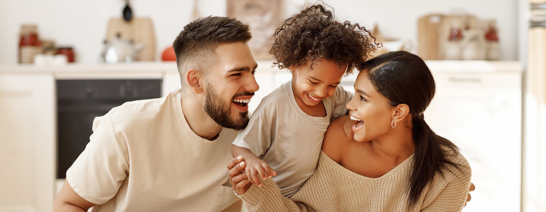 young family of three in living room